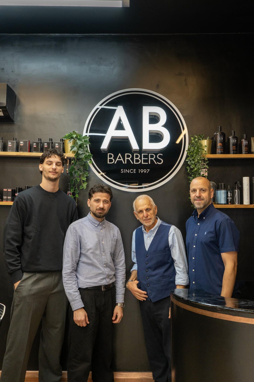 A barber at work inside AB Barbers